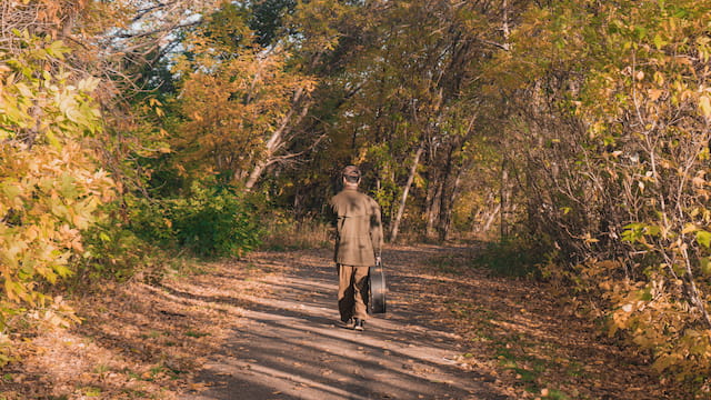 autumn filter along forested paved pathway mitch park blah148